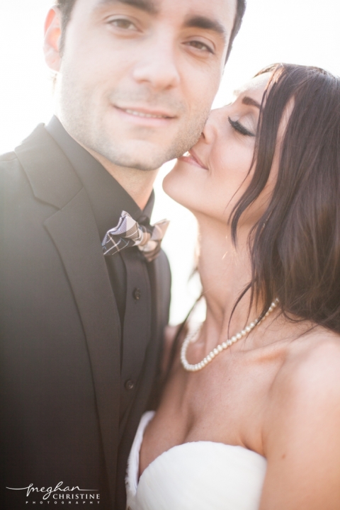 Four Seasons Biltmore Wedding Wife kissing Husband's Cheek Photo