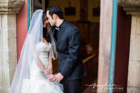 Santa Barbara Mission Wedding Husband and Wife Standing at Doorway Eyes Closed Photo