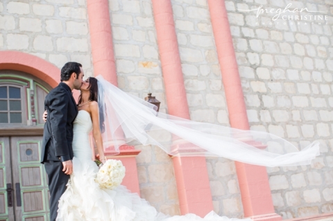 Santa Barbara Mission Wedding Husband and Wife Kissing Wind in Veil Photo